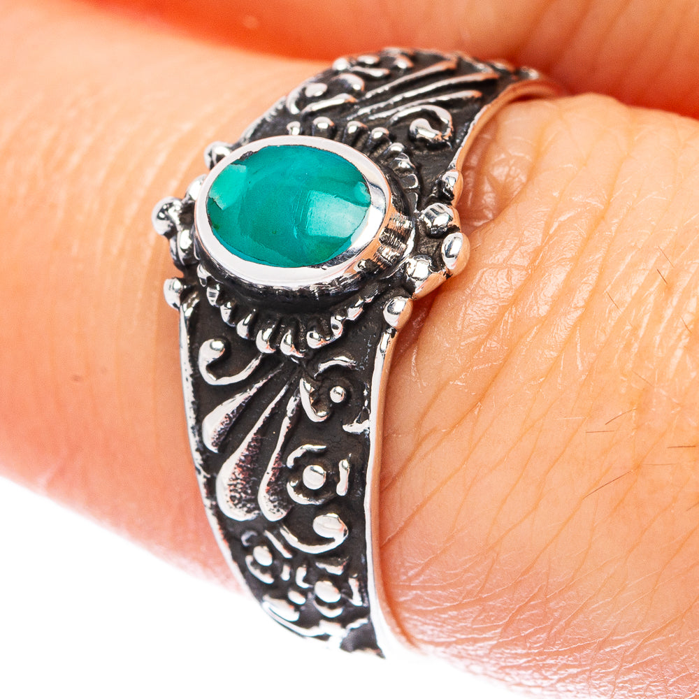 Turquoise gemstone ring in sterling silver with ornate carved band and oval green center stone