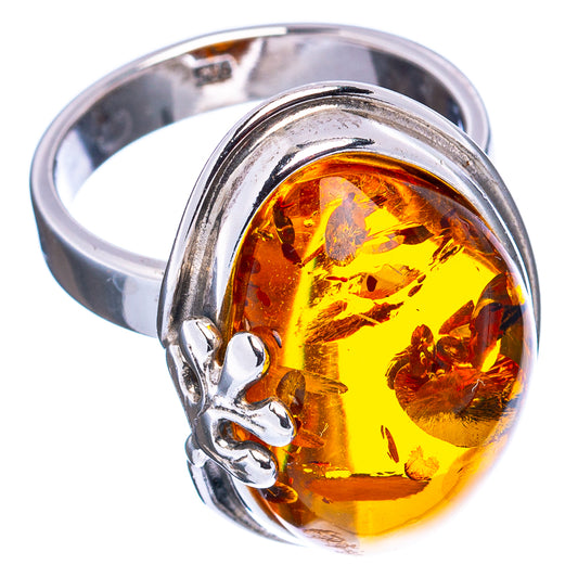 Oval amber stone ring with leaf inclusions in .925 sterling silver band