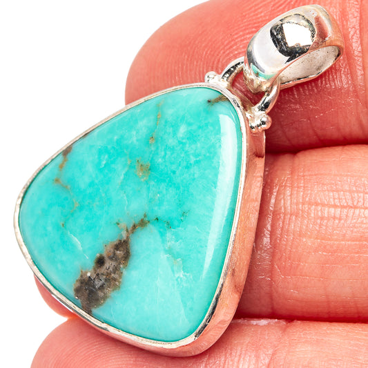 Turquoise teardrop pendant in .925 sterling silver with attached bail, close-up.