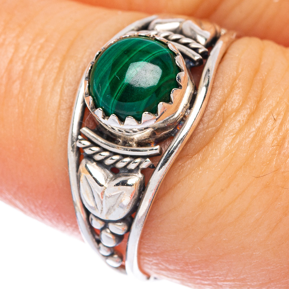 Sterling silver ring with green round malachite cabochon and engraved cuff-like band