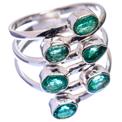 Sterling silver ring with oval green emerald cabochon stones, side view