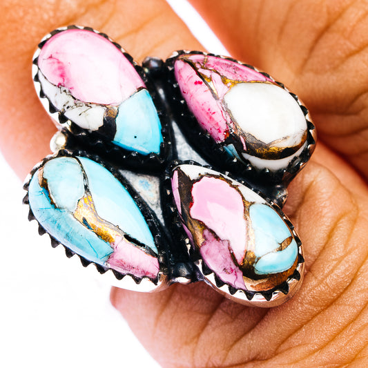 Southwestern-style gemstone inlay ring with turquoise, pink, and white stones in silver setting