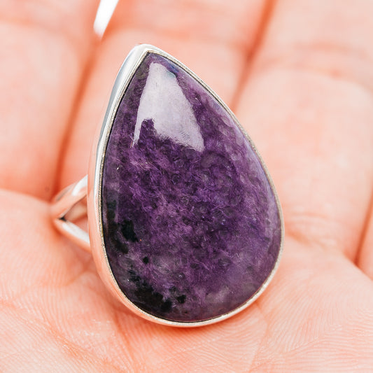 Teardrop charoite cabochon ring with purple gemstone, set in .925 sterling silver.