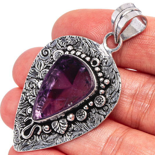 German silver amethyst pendant with ornate filigree and teardrop purple gemstone