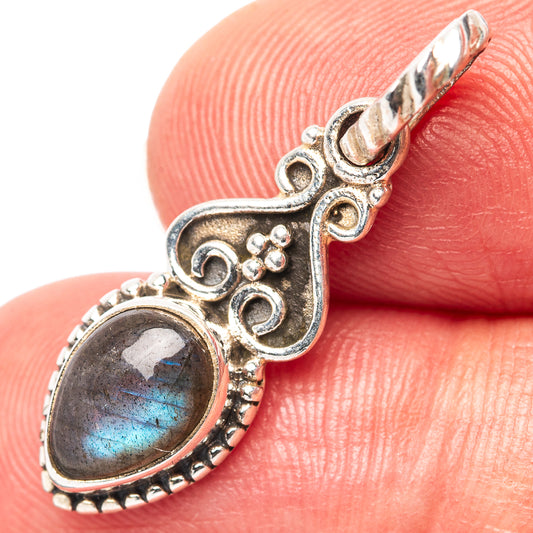 Oval labradorite pendant in sterling silver with ornate filigree and beaded rim