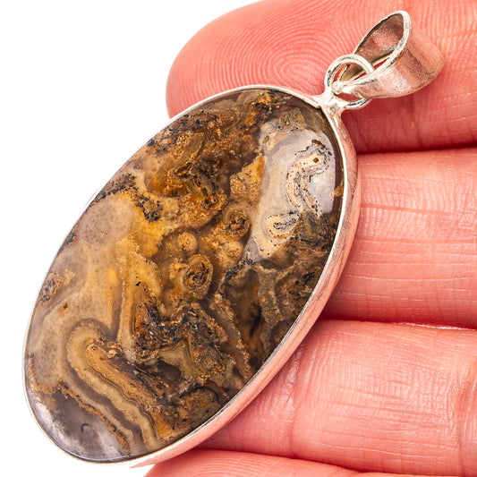 Silver-plated tube agate pendant with oval banded stone, brown and white