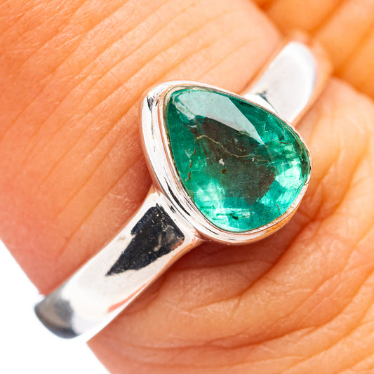 Sterling silver ring with oval green emerald gemstone in raised bezel