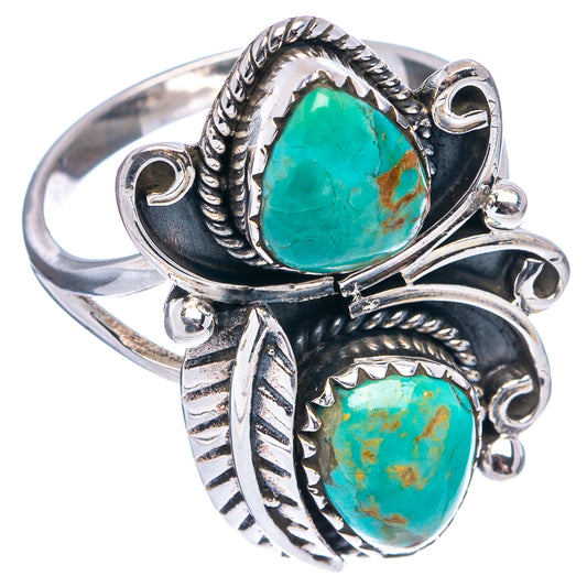 Sterling silver ring with two turquoise oval stones and detailed leaf-and-braid accents