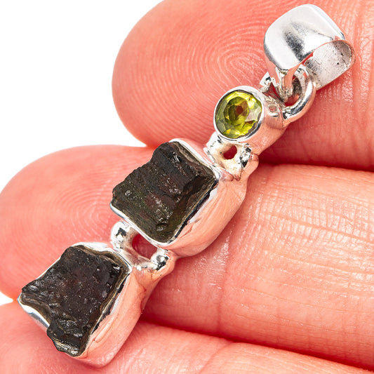 Sterling silver pendant with round peridot and rough dark green stone segments