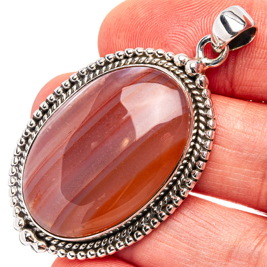 Oval carnelian pendant with beaded .925 sterling silver bezel and bail