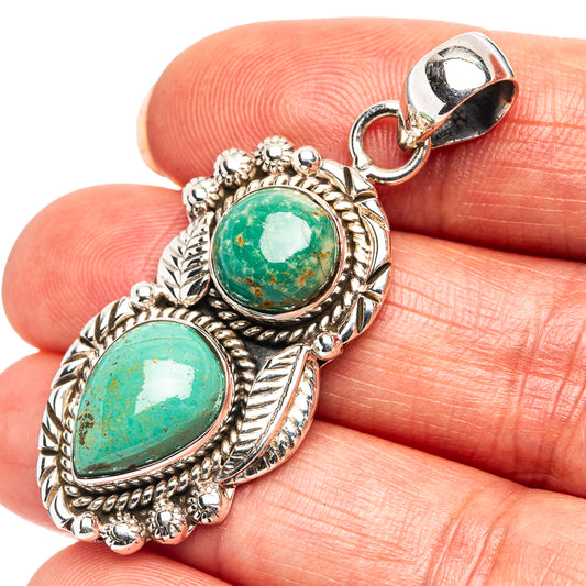 Oval green variscite double-stone pendant in 925 silver, shown close-up on finger