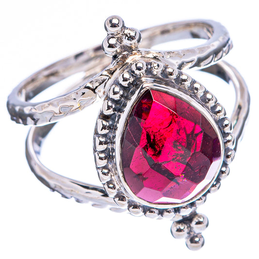 Sterling silver garnet ring with oval faceted dark red gemstone and ornate split band