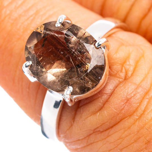 Sterling silver ring with oval faceted dark brown Super Seven gemstone, 4-prong setting