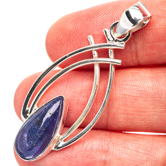 Sterling silver pendant with blue teardrop gemstone and arched halo design