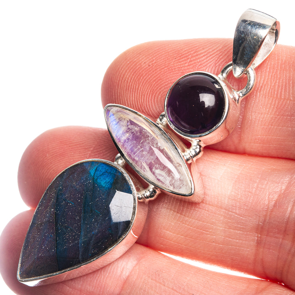 Sterling silver gemstone pendant with round purple stone and two marquise stones