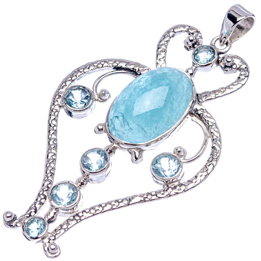 Sterling silver heart-shaped pendant with oval aquamarine-blue stone and round blue accents