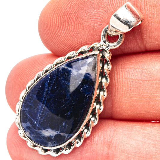 Sterling silver teardrop sodalite pendant with filigree border and bail loop