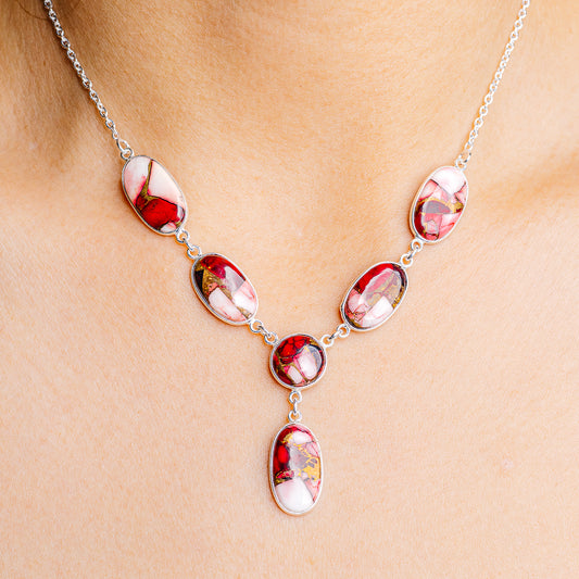 Sterling silver necklace with oval red and pink stone stations on a fine chain
