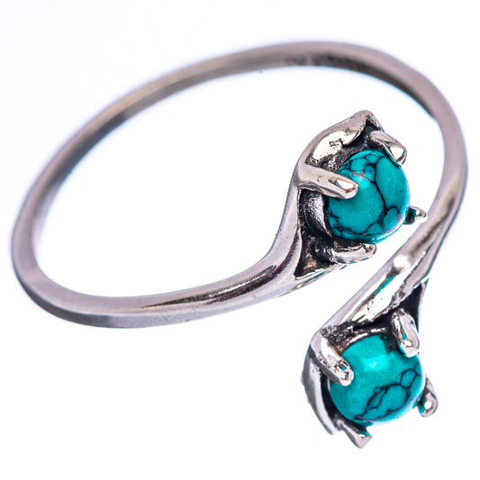 Sterling silver ring with two turquoise oval cabochons and sculpted open band