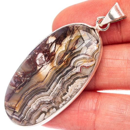 Silver-plated oval lace agate pendant with multicolor banded pattern and top bail