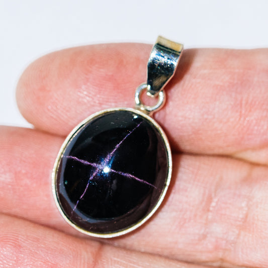 Star garnet pendant in .925 sterling silver, round black gemstone with starburst reflections