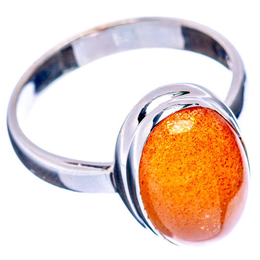 Orange sunstone oval cabochon bezel with polished .925 sterling silver ring band