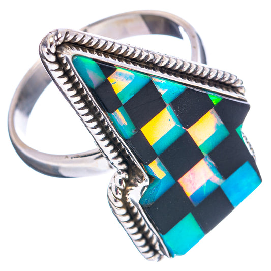 Silver-toned ring with black, blue, and gold geometric lightning-bolt mosaic inlay