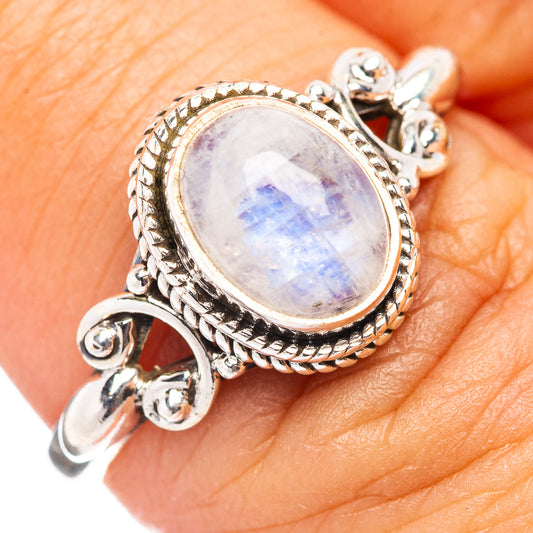 Sterling silver moonstone ring with oval rainbow moonstone and ornate braided bezel