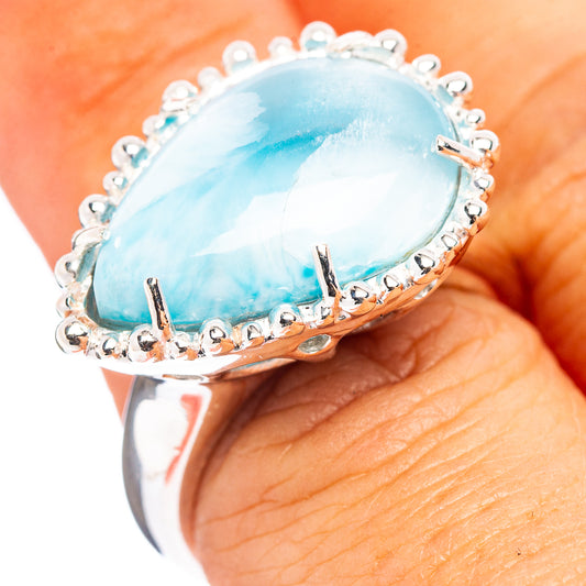 Sterling silver Larimar oval ring with blue gemstone bezel and scalloped edge