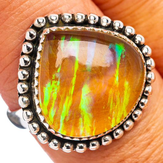 Ethiopian opal ring with oval orange rainbow opal, .925 sterling silver beaded bezel
