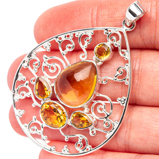 Sterling silver pendant with amber citrine teardrop stones and ornate filigree frame