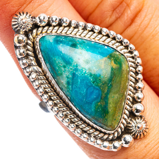 Sterling silver opal ring with blue-green teardrop cabochon and beaded edge detail