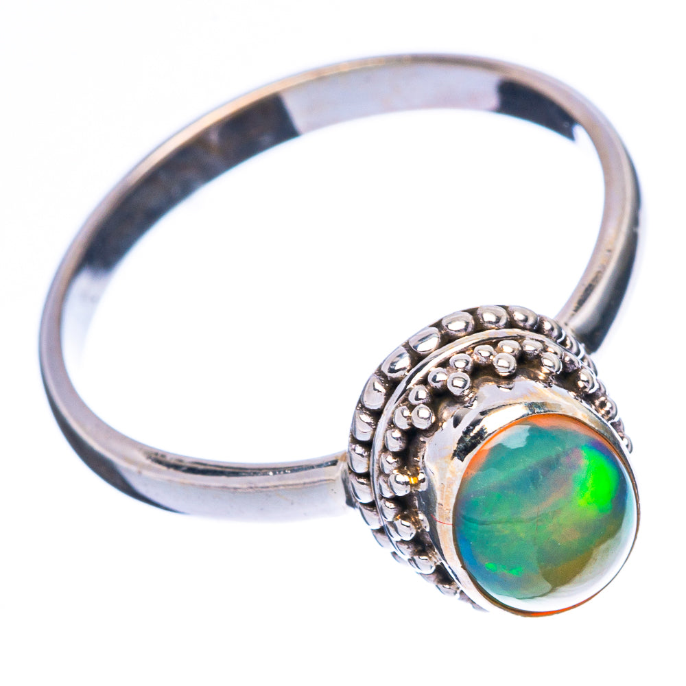 Sterling silver opal ring with oval green opal bezel and ornate side band