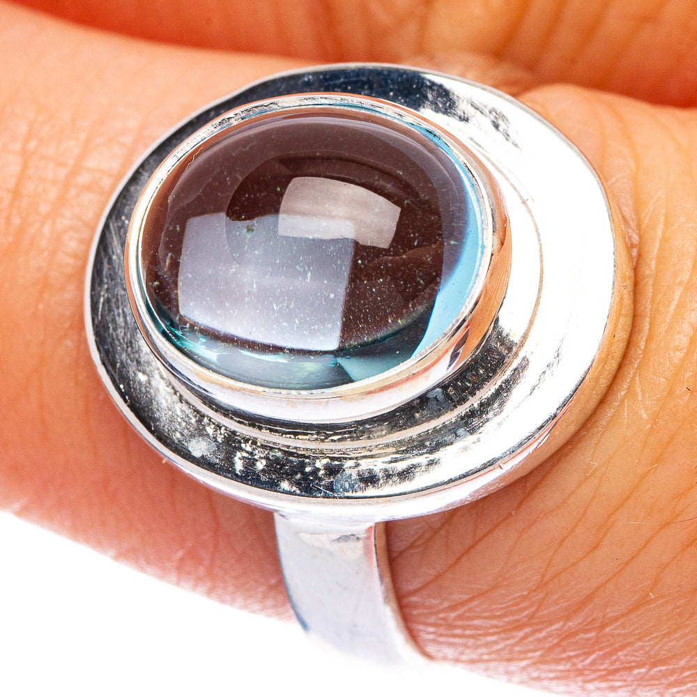 Sterling silver ring with oval aquamarine gemstone in polished bezel