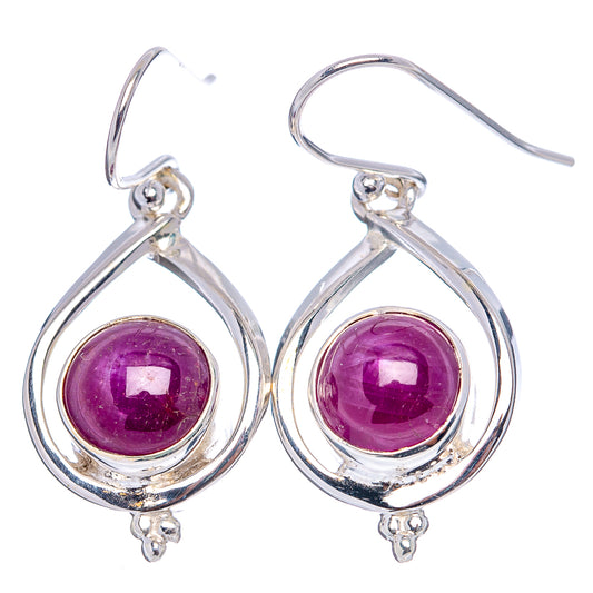 Sterling silver lever-back earrings with purple ruby cabochons and teardrop frames