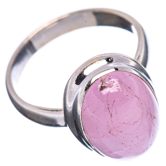 Rose-pink oval gemstone ring with silver band and bezel setting, side angle