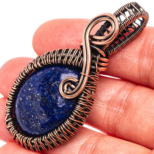 Oxidized copper wire-wrapped lapis lazuli teardrop pendant, close-up bail