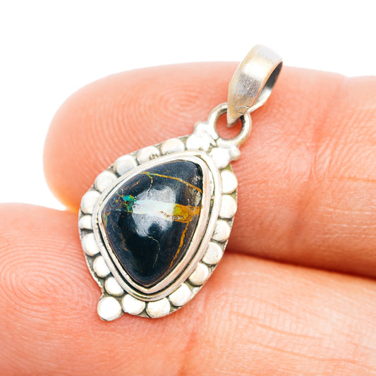 Sterling silver pendant with oval dark blue turquoise-look stone, scalloped bezel