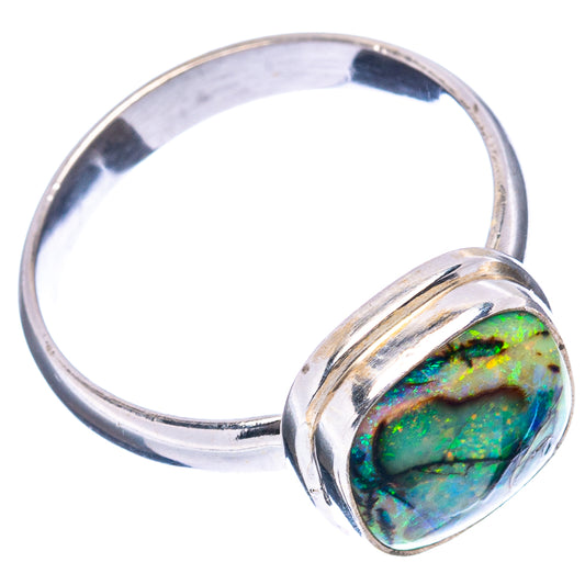 Sterling silver oval opal ring with iridescent green-blue stone and smooth band