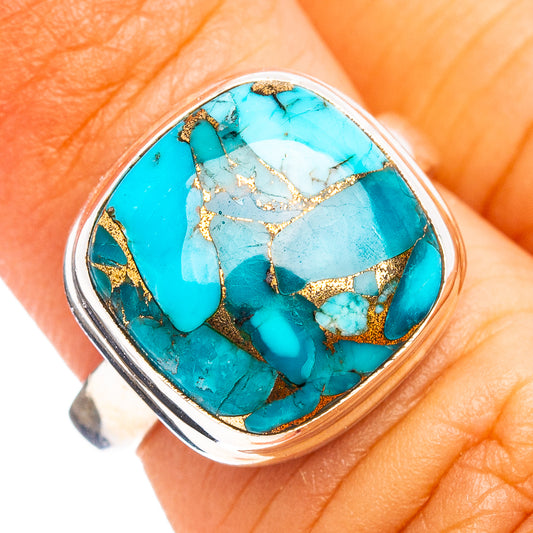 Sterling silver ring with large oval blue turquoise cabochon and gold veining