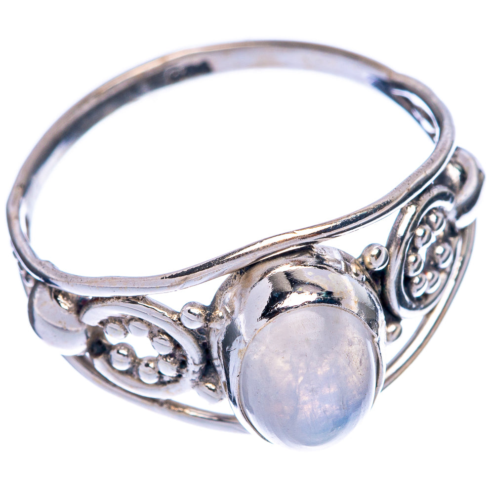 Sterling silver dainty ring featuring round opalescent moonstone and ornate side filigree