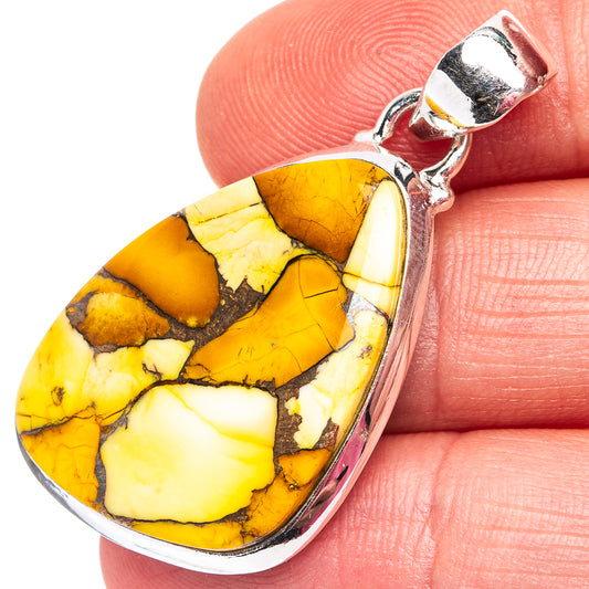 Silver teardrop pendant with yellow-orange stone cabochon, rounded bale detail