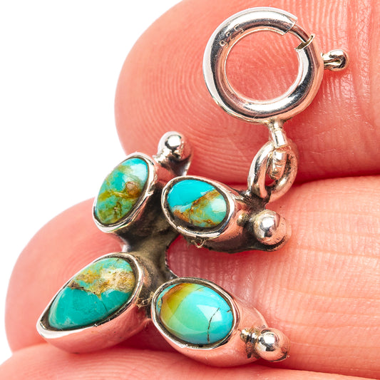 Turquoise oval pendant charm with sterling silver bezels and ring clasp, small detail view