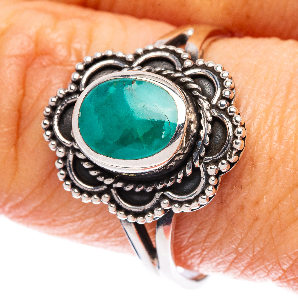 Sterling silver ring with oval turquoise cabochon and ornate black filigree setting