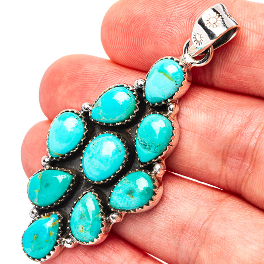 Turquoise cluster pendant with oval stones in sterling silver bezel, leaf motif bail