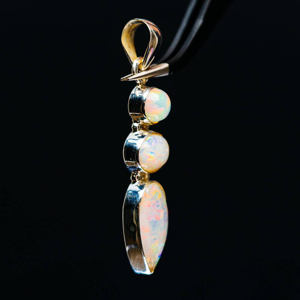 Sterling silver opal pendant with round and oval cabochons and a teardrop stone