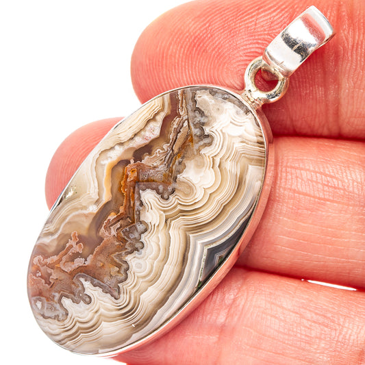 Oval lace agate pendant with sterling silver bail, beige and brown banded patterns