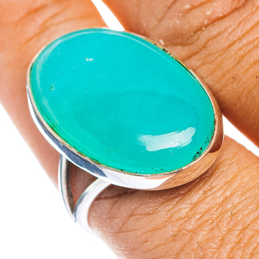 Oval turquoise cabochon sterling silver ring with raised bezel