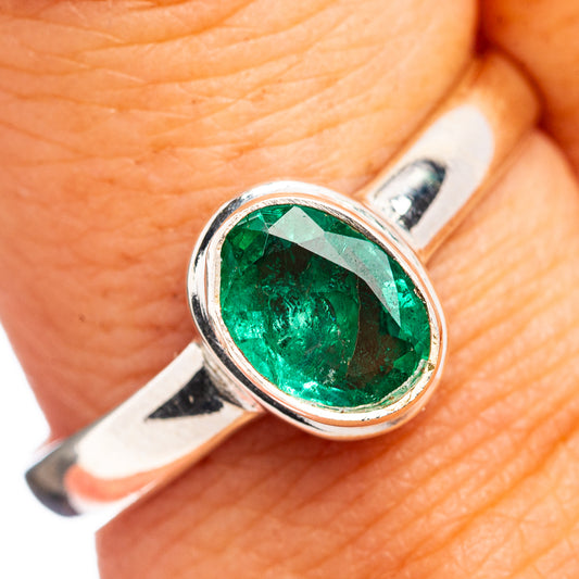 Oval green emerald gemstone ring in .925 sterling silver bezel setting with slim band