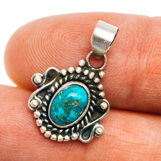 Turquoise pendant with oval cabochon in ornate .925 sterling silver setting